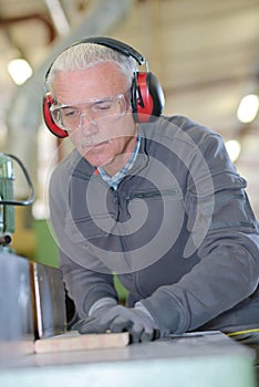 Image mature carpenter in workshop