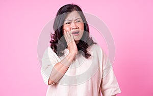 Image of middle aged Asian woman on pink background