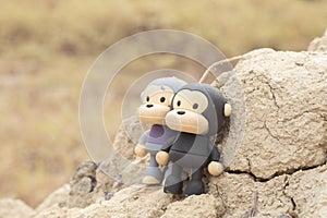 image of the monkey toys on the dried plateau hill