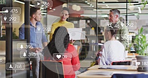 Image of multiple notification bars over diverse coworkers sharing ideas in office