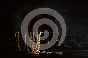 Image of mysterious opened old wooden treasure chest with light. An adventure and fantasy medieval period. Selective focus.