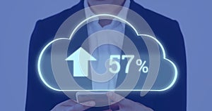 Image of ncloud with percent growing over caucasian businesswoman using smartphone