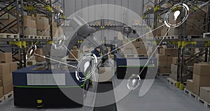 Image of network of conncetions with icons over boxes on conveyor belt in warehouse