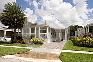 Image of a new mobile home with carport photo