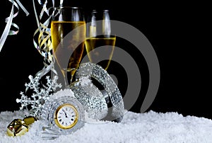Image for New Year includes the face of a clock nearing twelve o`clock and sparkly accent pieces.