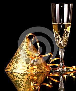 New years eve celebration with glass of champagne and party hat