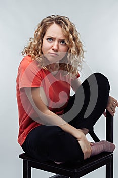 Image of nice brooding woman thinking and looking at camera. Human emotions, facial expression concept