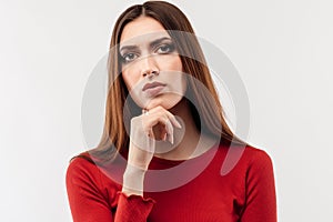 Image of nice serious woman thinking and looking at camera. Human emotions, facial expression concept