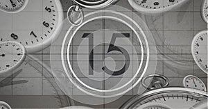 Image of number fifteen in vintage black and white film projector countdown with clocks and watches