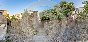 Image of an old cobblestone path in the historic Croatian town of Motovun in the morning