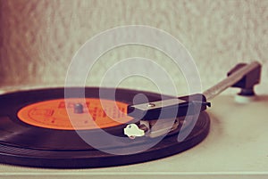 Image of old record player, image is retro filtered . selective focus