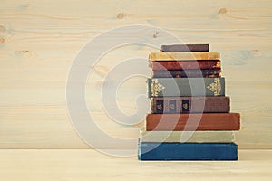 Image of old vintage books on a wooden shelf