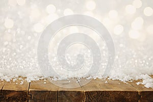 Image of old wooden table in front of glitter lights background. De-focused. Ready for product display montage.