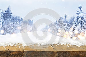 Image of old wooden table in front of magical winter landscape background. De-focused. Ready for product display montage.