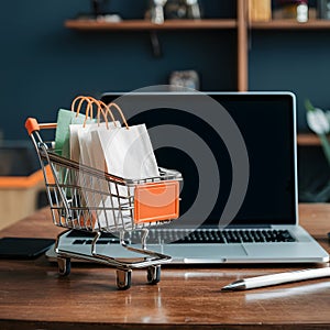 Image Online shopping concept cart, laptop on table