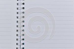 image of open notebook with blank page, lined paper texture background