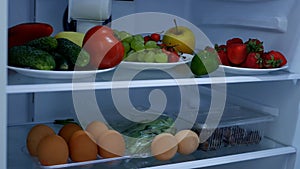 Image with an Open Refrigerator Full with  Fresh Fruits and Vegetables