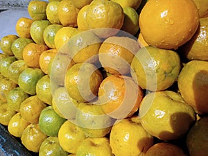 This is the image of orange fruits and some water on orange