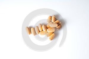 Image of orange pills isolated with shadows