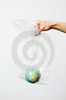 Our blue planet trapped in plastic waste stock photo