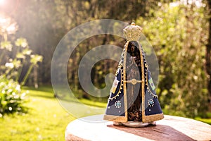 image of Our Lady of Aparecida, in a natural setting, space for text, copy space, catholic patron saint of brazil, christianity