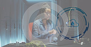 Image of padlock in circle over african american female engineer using laptop at data centre