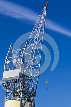 Image of a part of a crane with a blue sky background