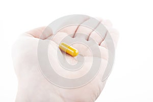 Image of pill hand white background