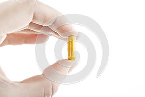 Image of pill hand white background