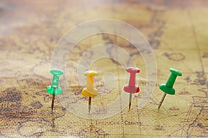 Image of pins attached to map, showing location or travel destination. selective focus.