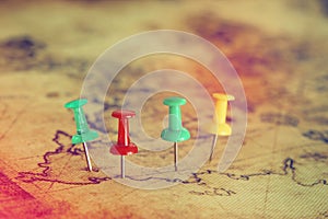 Image of pins attached to map, showing location or travel destination. selective focus.