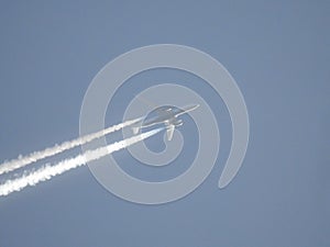 Plane spraying chem trails photo
