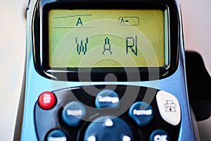 Digital representation of the word war on a printer. photo