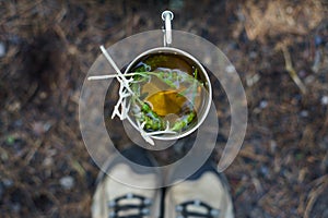 Image Portrait dog in motorcycle helmet. Vector illustration.A mug of herbal tea standing on the ground. Breakfast on the nature.