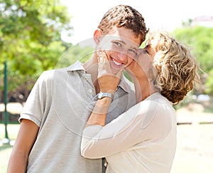 Image of Portrait of a happy senior woman kissing