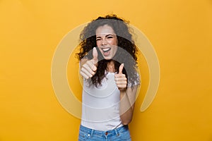 Image of positive woman 20s with curly hair smiling and showing