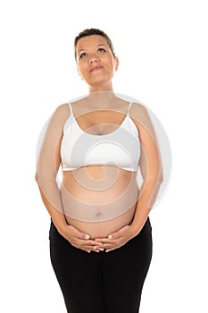 Image of pregnant woman touching her belly with hands