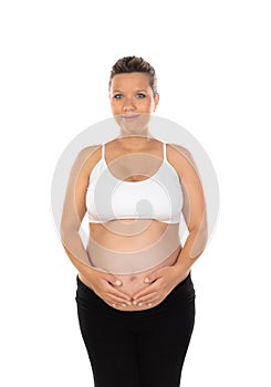 Image of pregnant woman touching her belly with hands