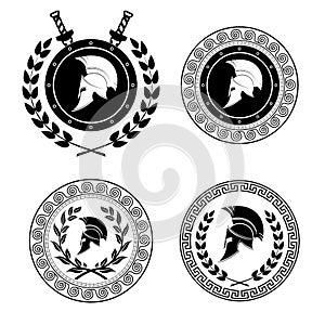 Symbol a Spartan helmet is issued by an ornament in the Greek style. photo
