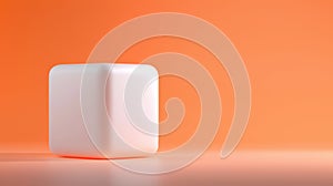 A white cube sits on a gradient orange background.