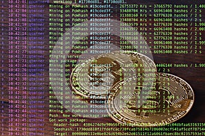 Image of the program code showing the process of mining the crypto currency in the background of the image with bitcoin