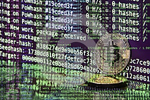 Image of the program code showing the process of mining the crypto currency in the background of the image with bitcoin