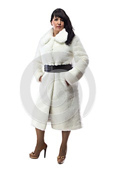 Image of pudgy brunette in long white coat