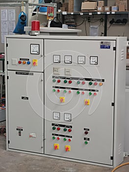 Image of pump control panel on concrete floor.