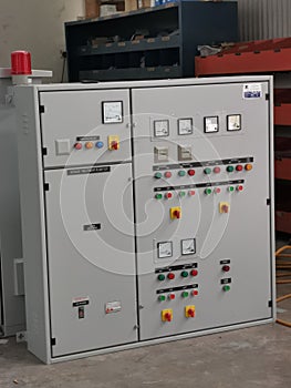 Image of pump control panel on concrete floor.