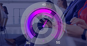 Image of purple speedometer over hands of diverse businesspeople with electronic devices