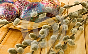 image of pussy-willow and easter eggs on a table closeup