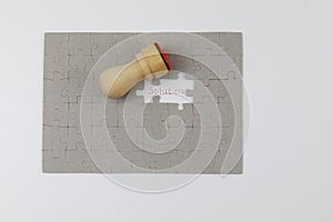 Image of Puzzle piece with solution and Official seal