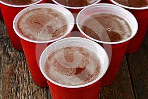 Red Plastic Drinking Cups Filled With Beer photo