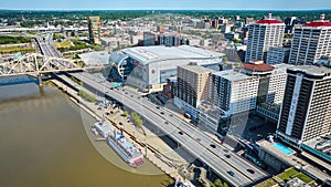 Riverfront boats aerial Ohio River bridge and hotels near downtown Louisville Kentucky USA